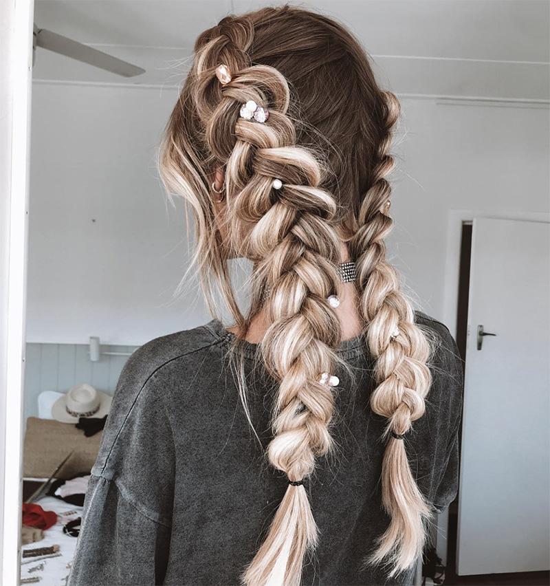 Girl with double braid hairstyle for Coachella festival